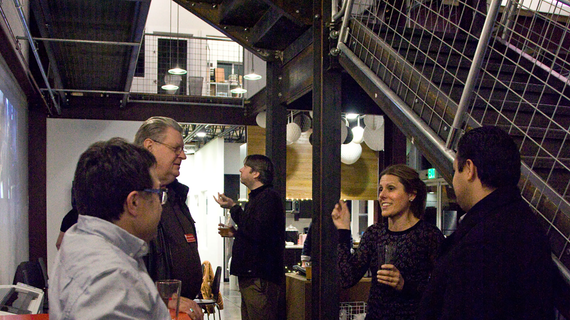 Group of people talking holding champagne