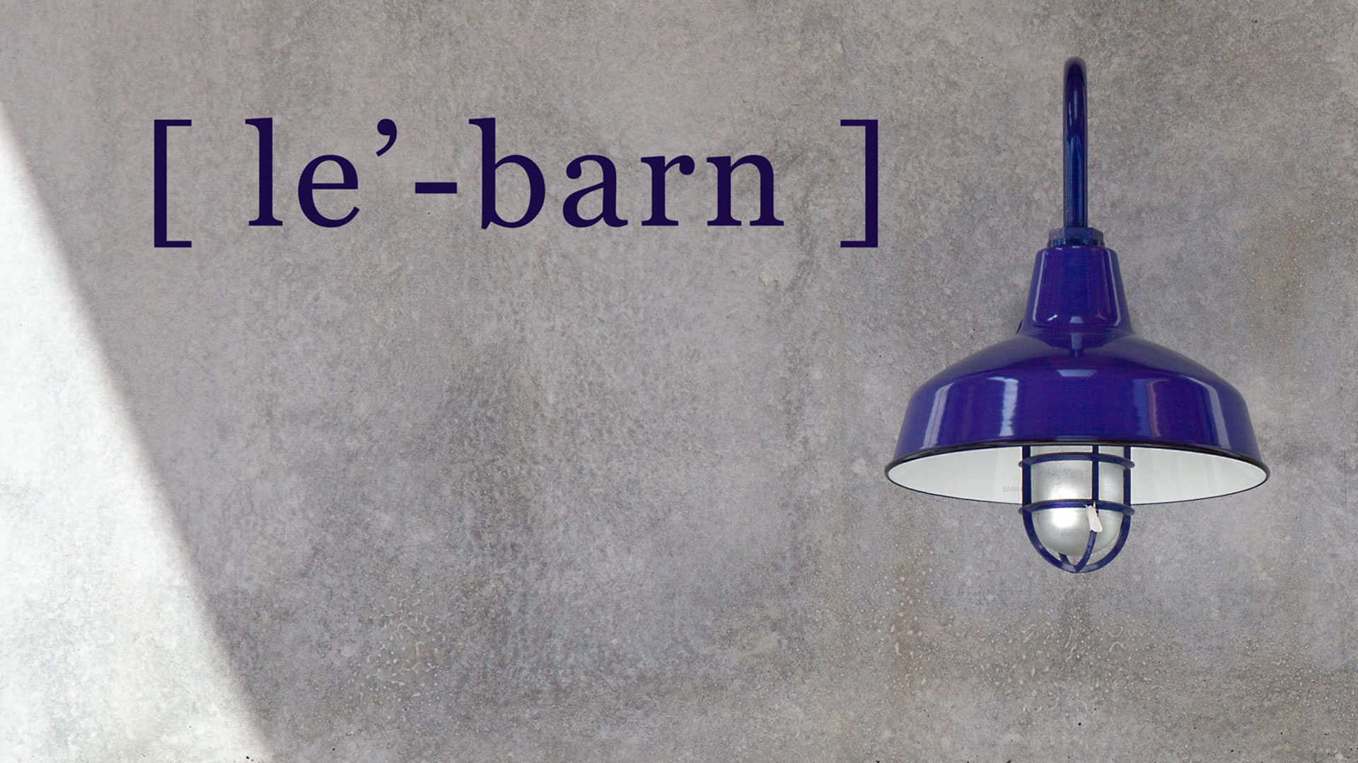 Le' Barn, purple letters against gray concrete. Purple light fixture adjacent