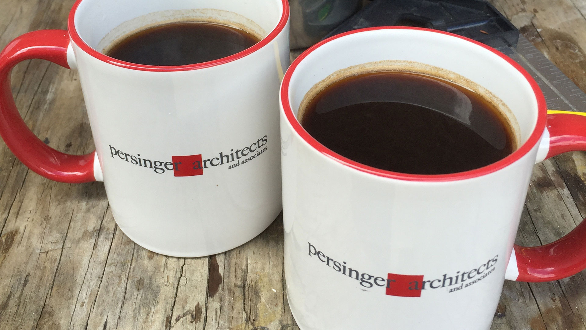 Closeup of persinger mugs with coffee inside