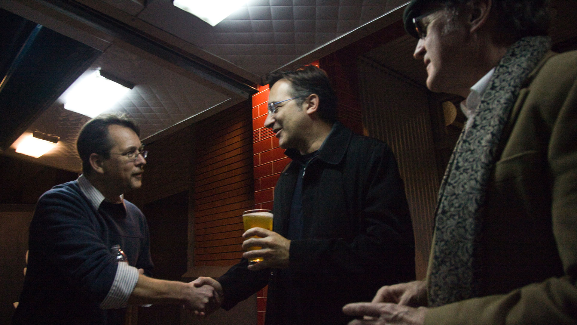 Persinger architects employee shaking hands with party attendee outside food truck