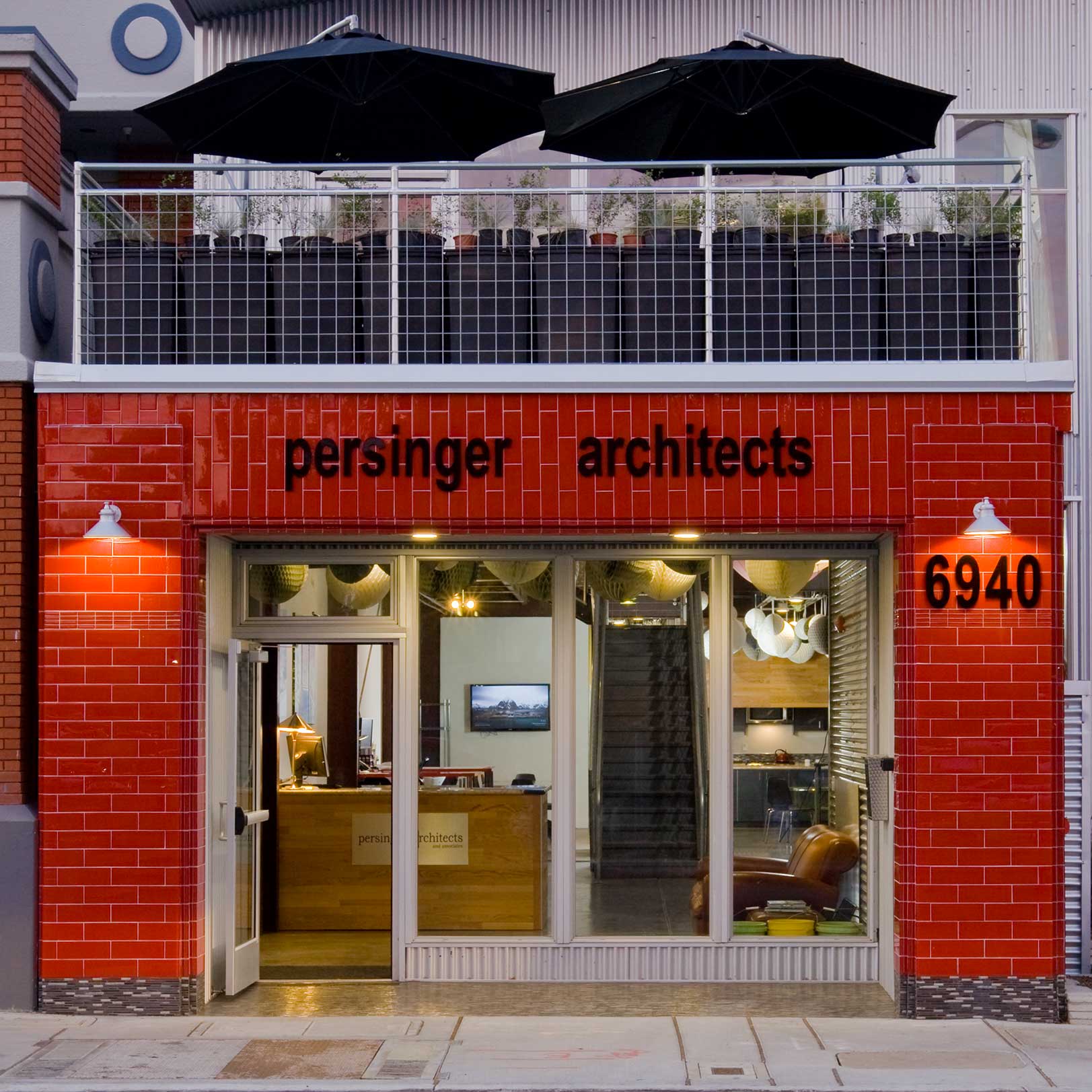 Front fiew of the old Persinger Architects headquarters, red tile facade and mezzanine above