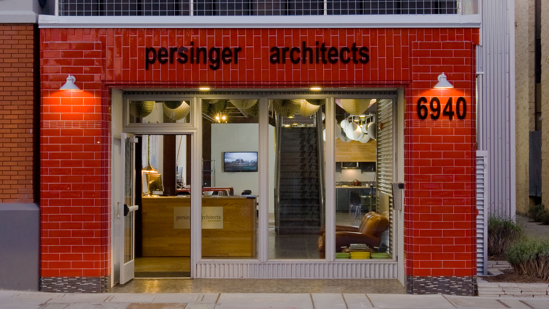 Front fiew of the old Persinger Architects headquarters, red tile facade and mezzanine above