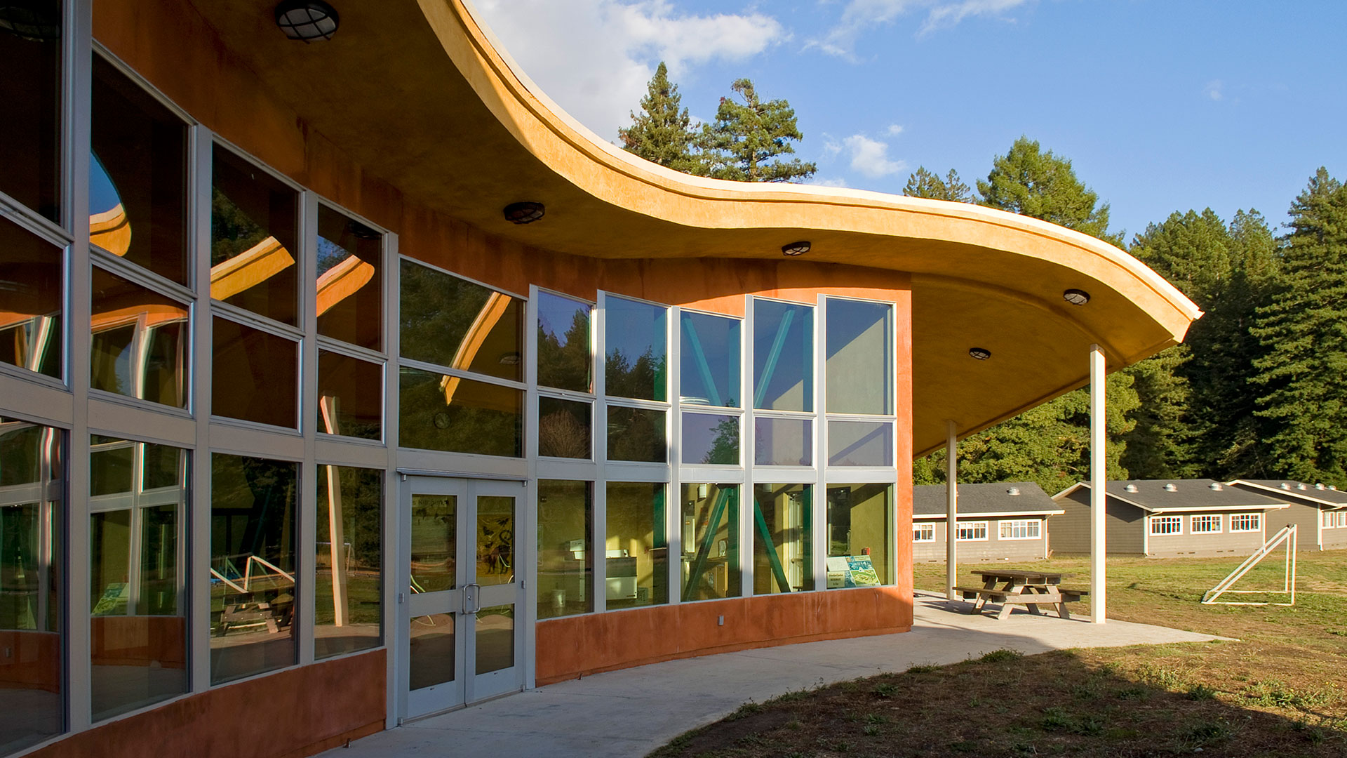Exterior windows of various heights to match curving of roof.