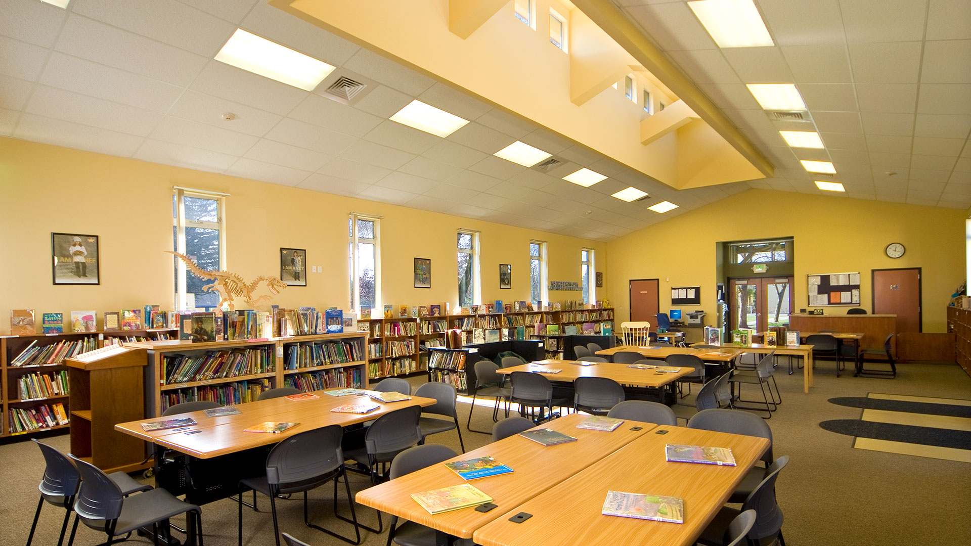 Library interior, yellow walls and bright, natural light from monitor above.