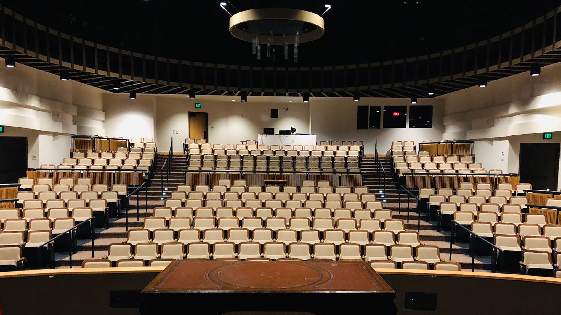 View from stage, looking out at multi-leveled sections of seating.