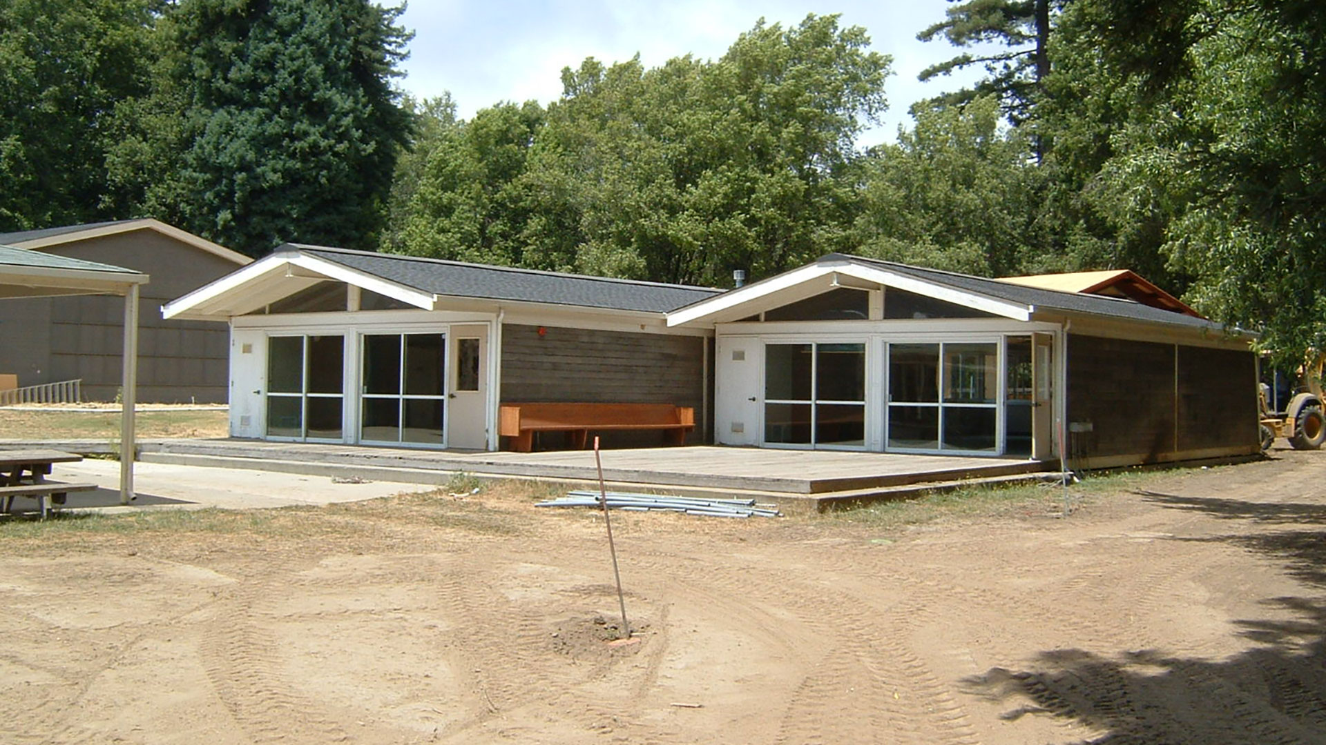 Buildings with gray siding and large vast widows.