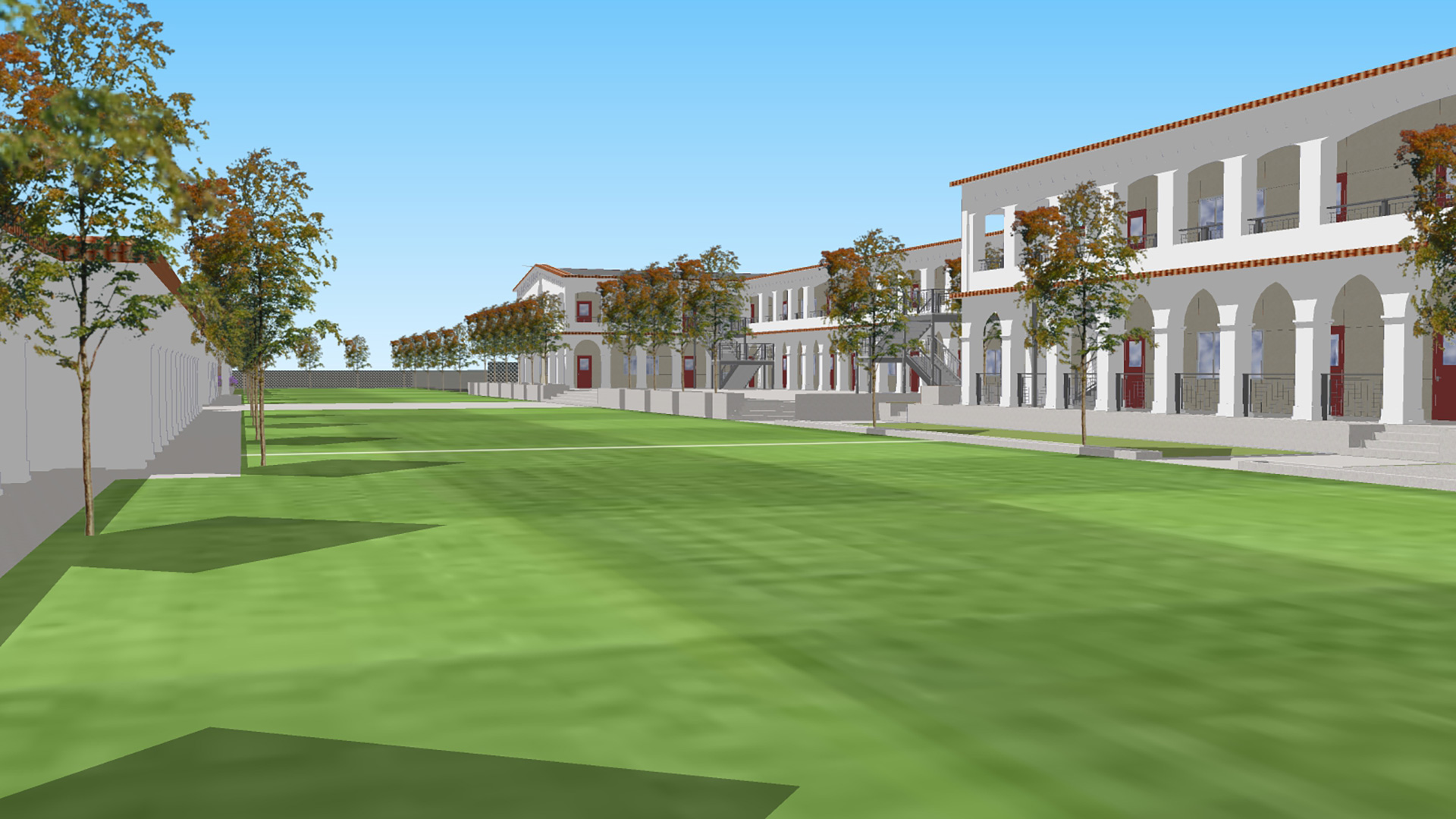 Campus rendering from parade field, with trees lining the sides and two-story buildings behind.