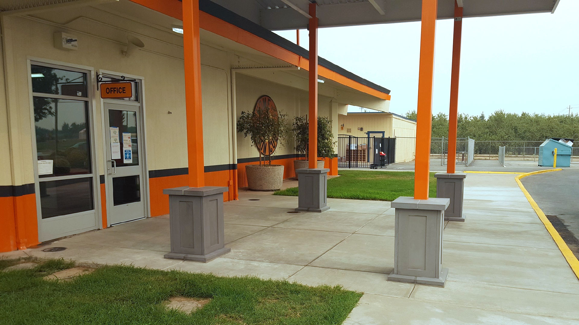 Front facade entryway during construction, with uncompleted shade structure.