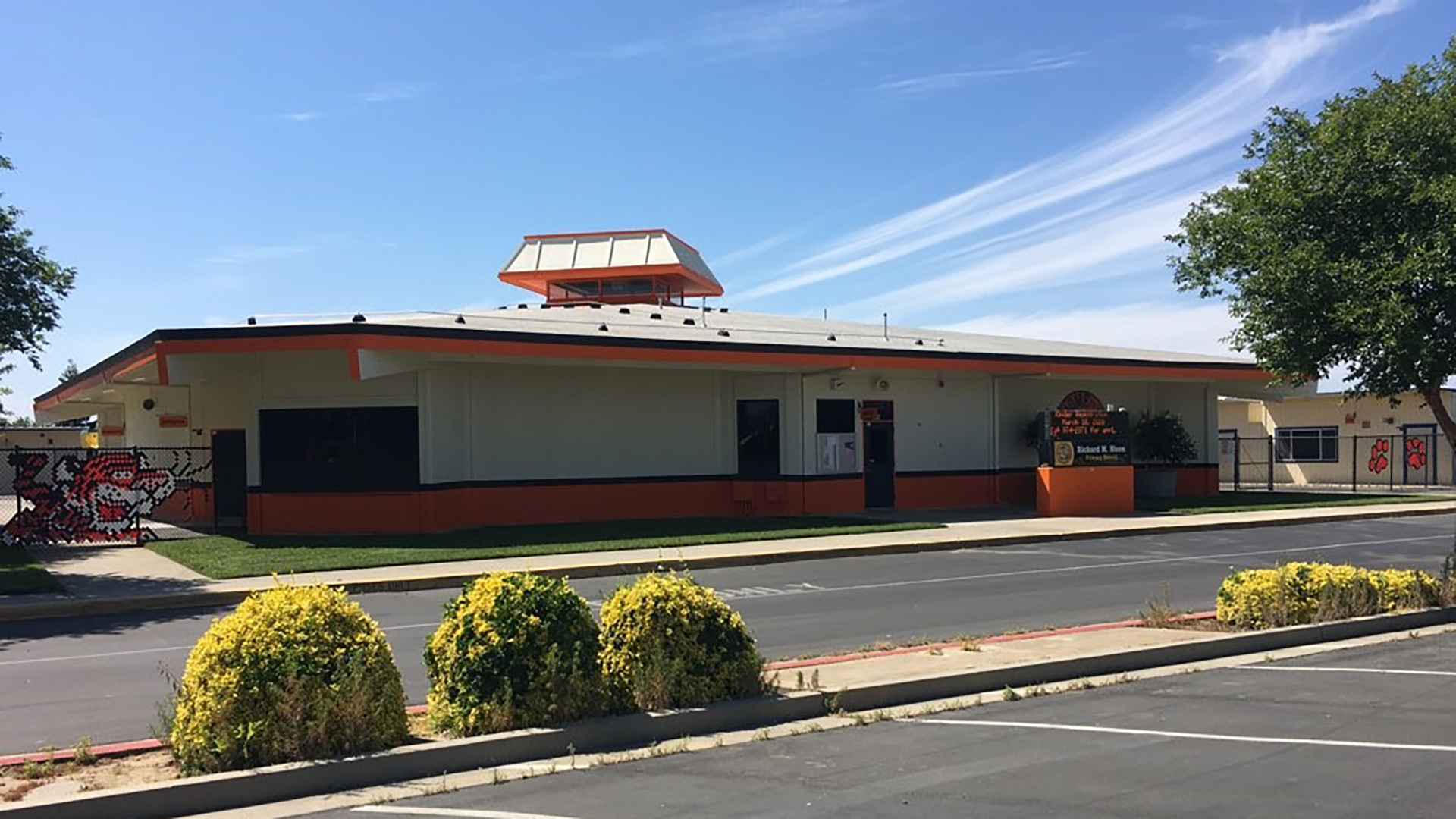 New orange and white painted building.